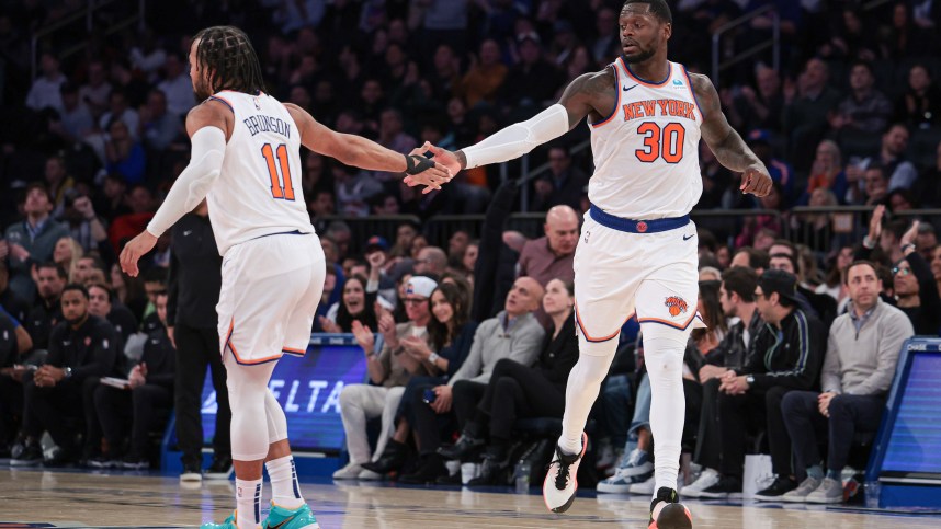 New York Knicks forward Julius Randle (30) slaps hands with guard Jalen Brunson (11) after a basket during the second half against the Detroit Pistons at Madison Square Garden