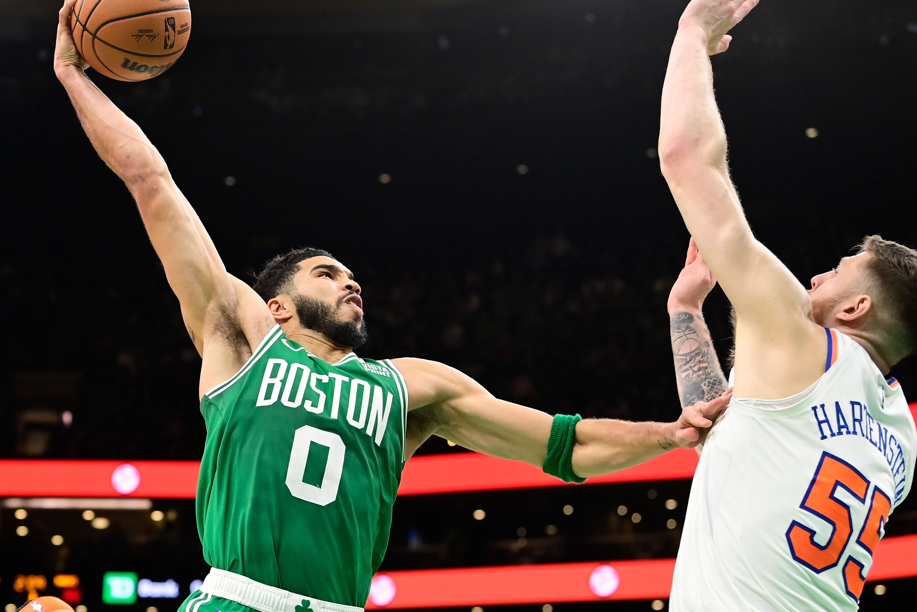 Boston Celtics forward Jayson Tatum (0) shoots over New York Knicks center Isaiah Hartenstein (55) during the second half at TD Garden