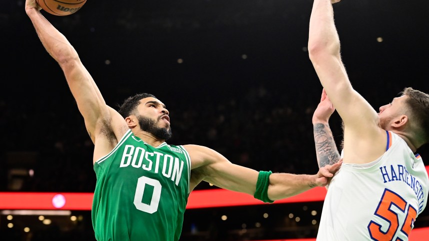 Boston Celtics forward Jayson Tatum (0)  shoots over New York Knicks center Isaiah Hartenstein (55) during the second half at TD Garden