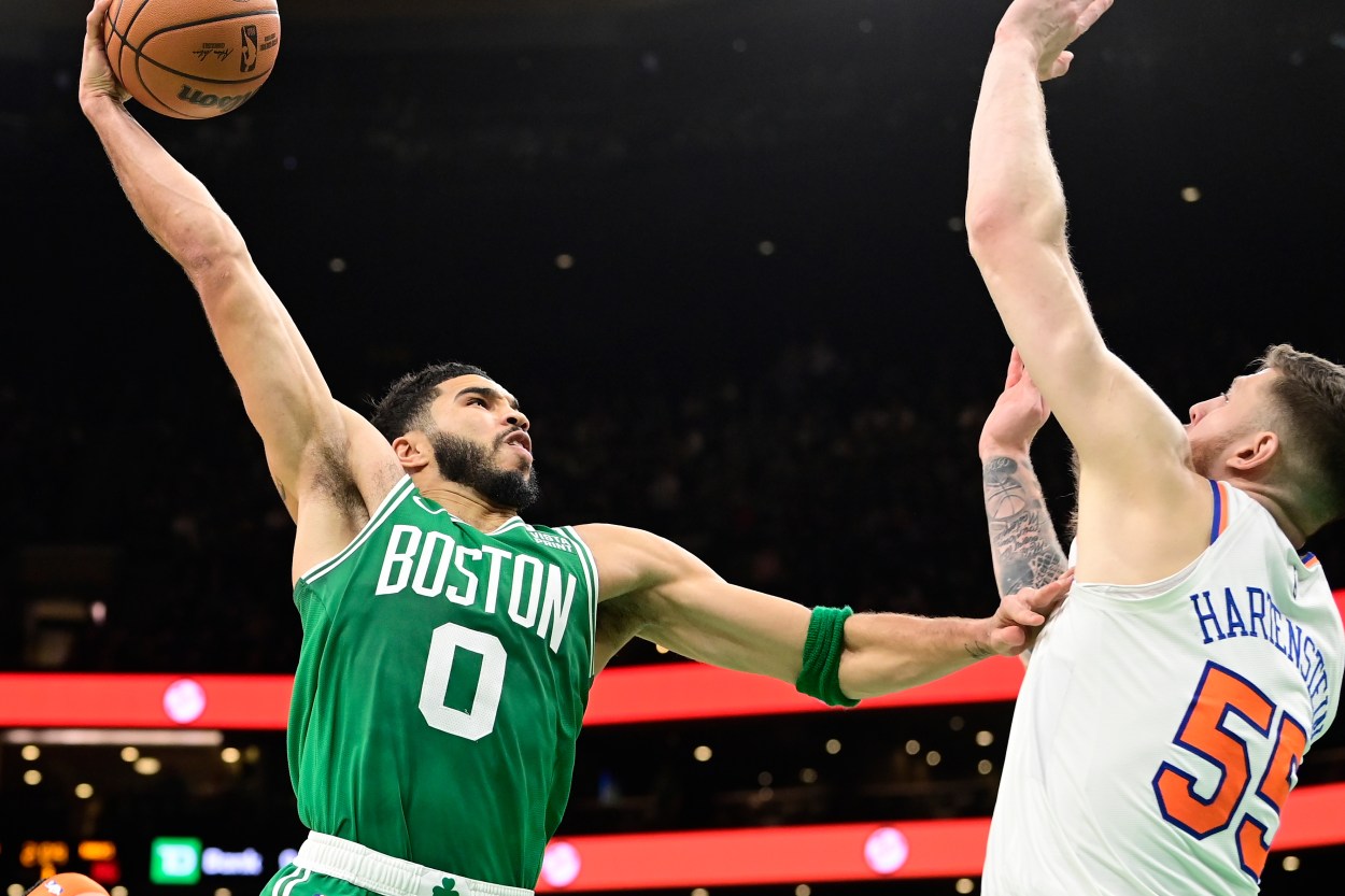 Boston Celtics forward Jayson Tatum (0)  shoots over New York Knicks center Isaiah Hartenstein (55) during the second half at TD Garden