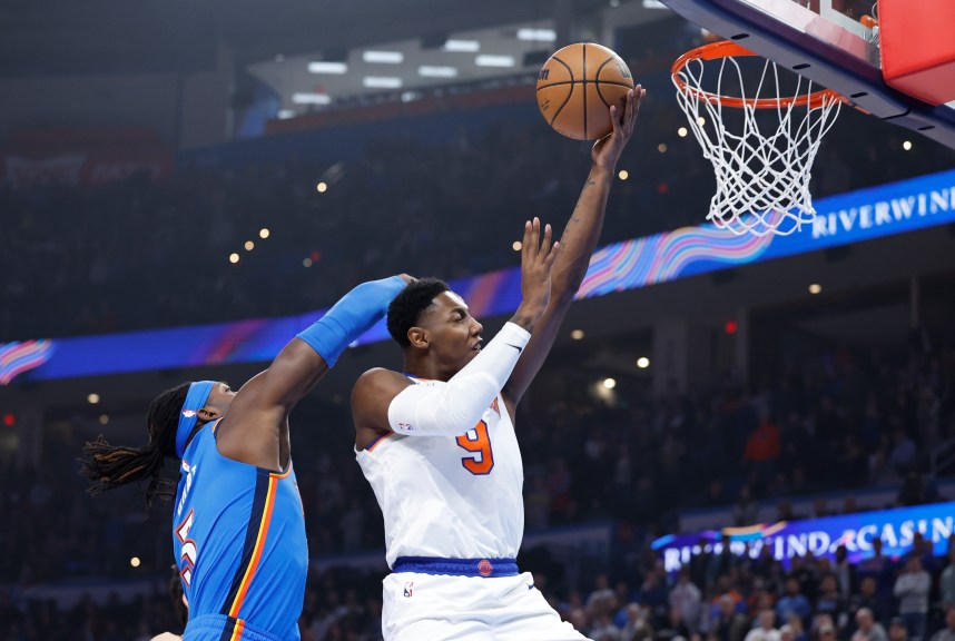 New York Knicks guard RJ Barrett (9) is fouled by Oklahoma City Thunder guard Shai Gilgeous-Alexander (2) on the way to the basket during the first quarter at Paycom Center