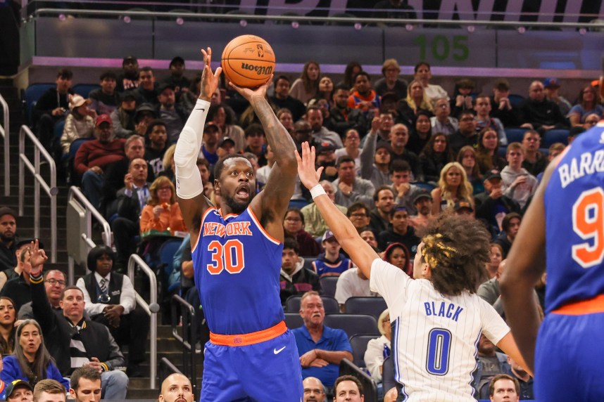 New York Knicks forward Julius Randle (30) shoots the ball over Orlando Magic guard Anthony Black (0) during the second quarter at KIA Center