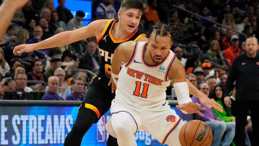 New York Knicks guard Jalen Brunson (11) drives on Phoenix Suns guard Grayson Allen (8) in the second half at Footprint Center