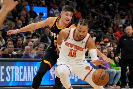 New York Knicks guard Jalen Brunson (11) drives on Phoenix Suns guard Grayson Allen (8) in the second half at Footprint Center