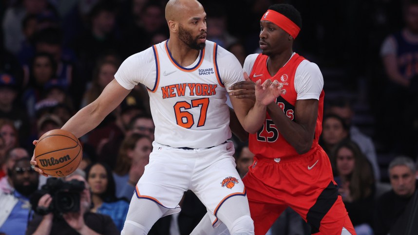 New York Knicks center Taj Gibson (67) dribbles against Toronto Raptors forward Chris Boucher (25) during the first half at Madison Square Garden