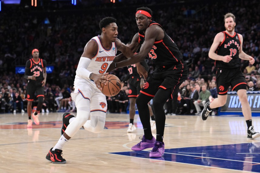New York Knicks guard RJ Barrett (9) drives to the basket as Toronto Raptors forward Pascal Siakam (43) defends during the second quarter at Madison Square Garden