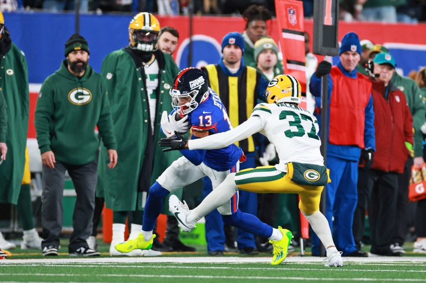 New York Giants wide receiver Jalin Hyatt (13) runs the ball as Green Bay Packers cornerback Carrington Valentine (37) defends during the second quarter at MetLife Stadium