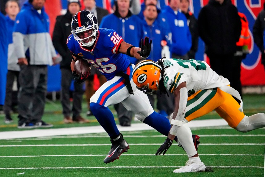 New York Giants running back Saquon Barkley (26) runs the ball against Green Bay Packers safety Darnell Savage (26) during the fourth quarter at MetLife Stadium
