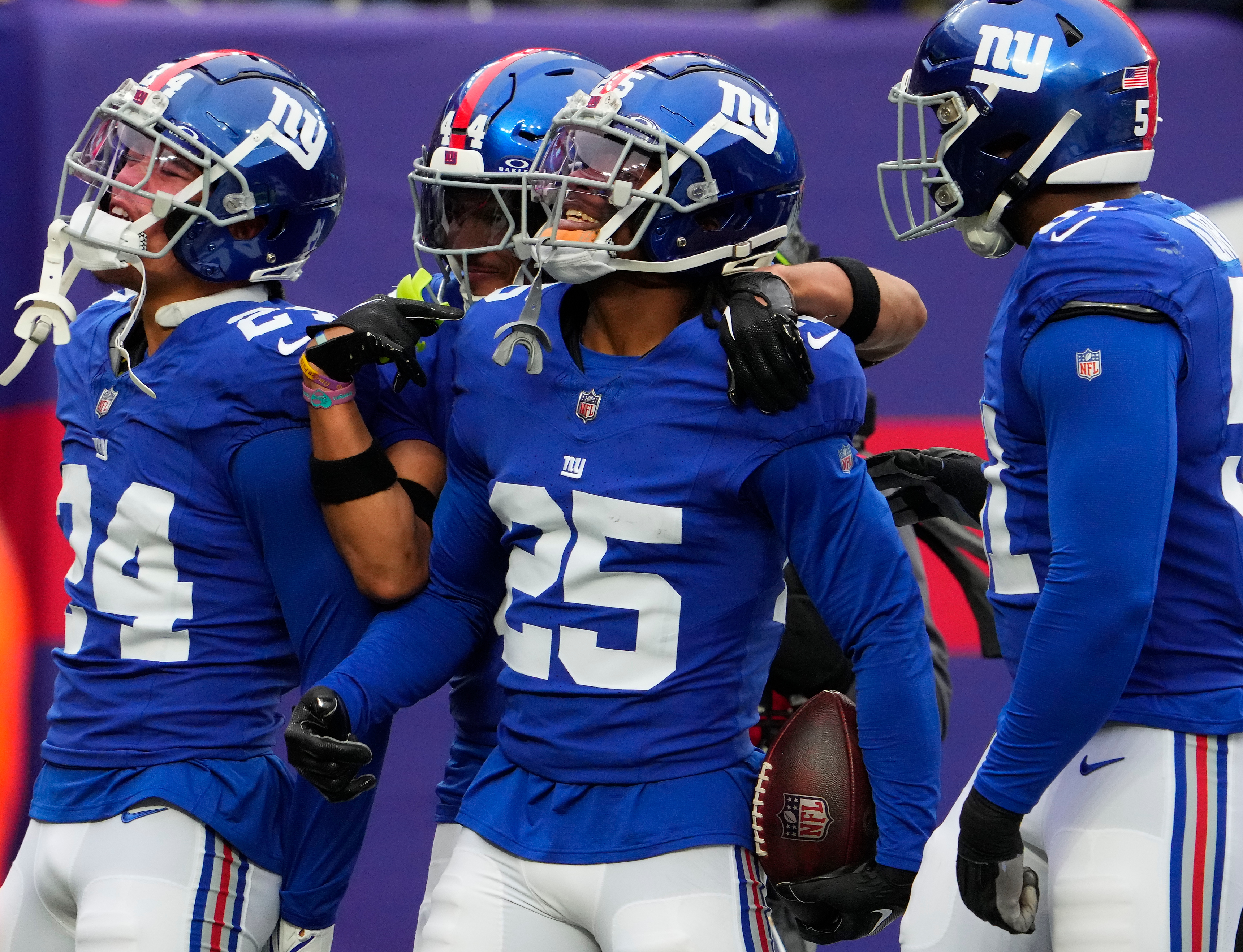 Nov 26, 2023; East Rutherford, New Jersey, USA; New York Giants cornerback Deonte Banks (25) celebrates an interception against New England Patriots in the 1st half at MetLife Stadium. Mandatory Credit: Robert Deutsch-USA TODAY Sports