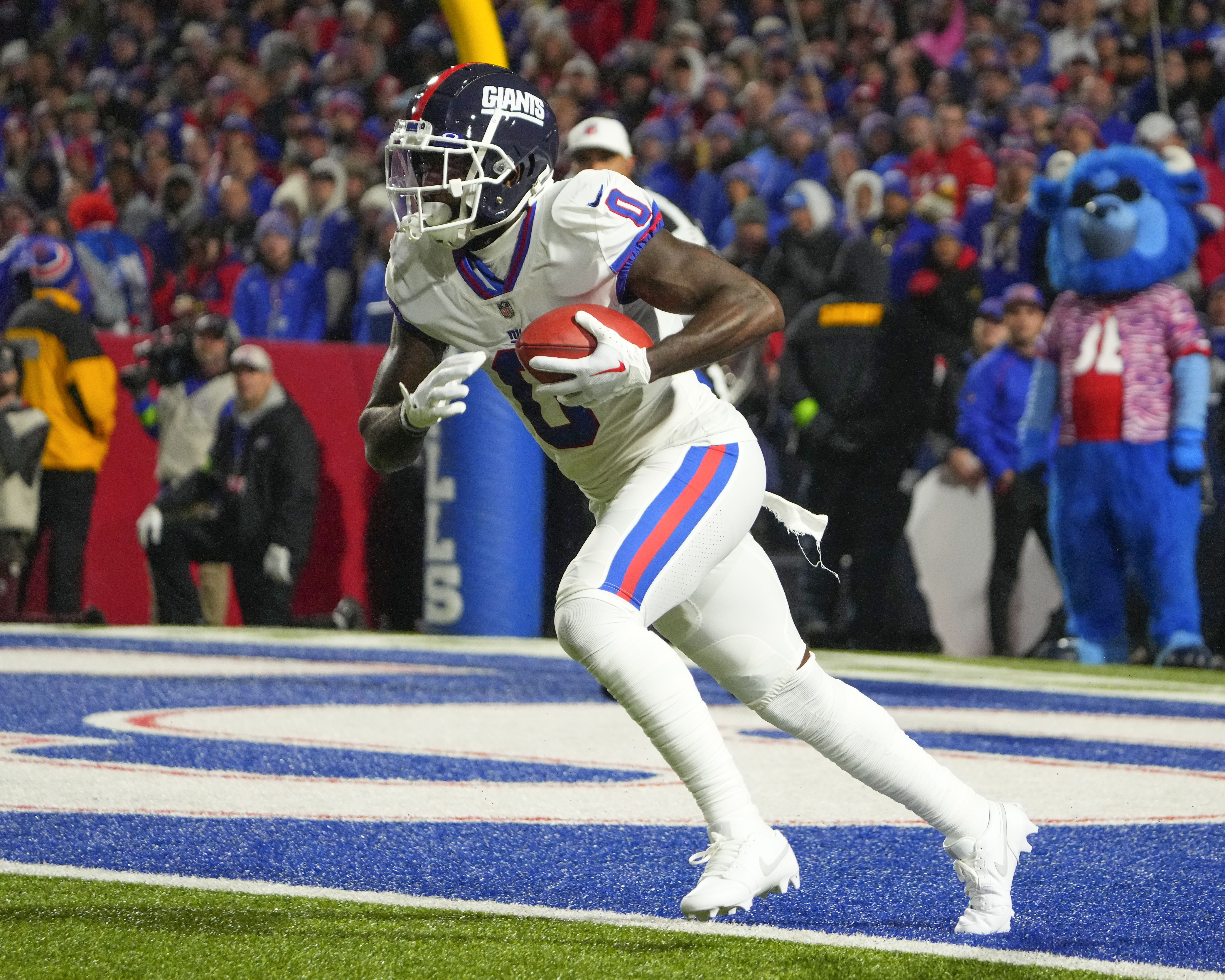 New York Giants wide receiver Parris Campbell (0) runs back a kick off against the Buffalo Bills during the second half at Highmark Stadium