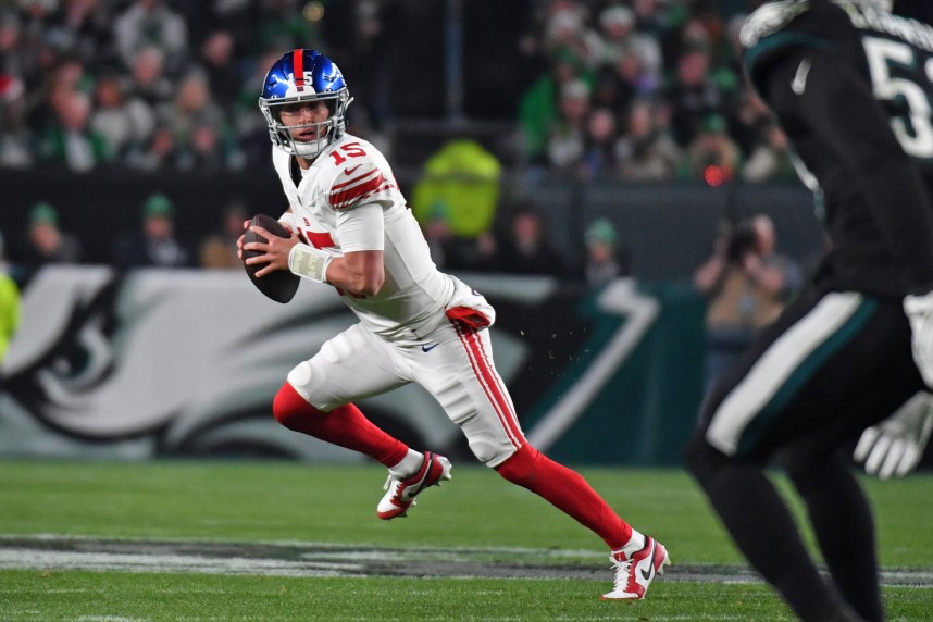 New York Giants quarterback Tommy DeVito (15) looks for a receiver against the Philadelphia Eagles during the second quarter at Lincoln Financial Field