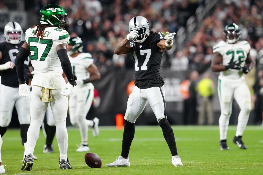 Las Vegas Raiders wide receiver Davante Adams (17) gestures after gaining a first down against the New York Jets during the second quarter at Allegiant Stadium