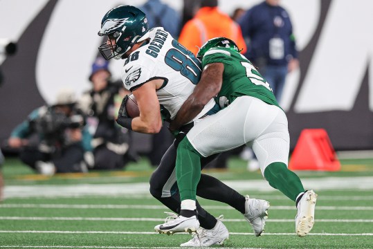 Philadelphia Eagles tight end Dallas Goedert (88) fights for yards as New York Jets linebacker Quincy Williams (56) tackles during the second half at MetLife Stadium.