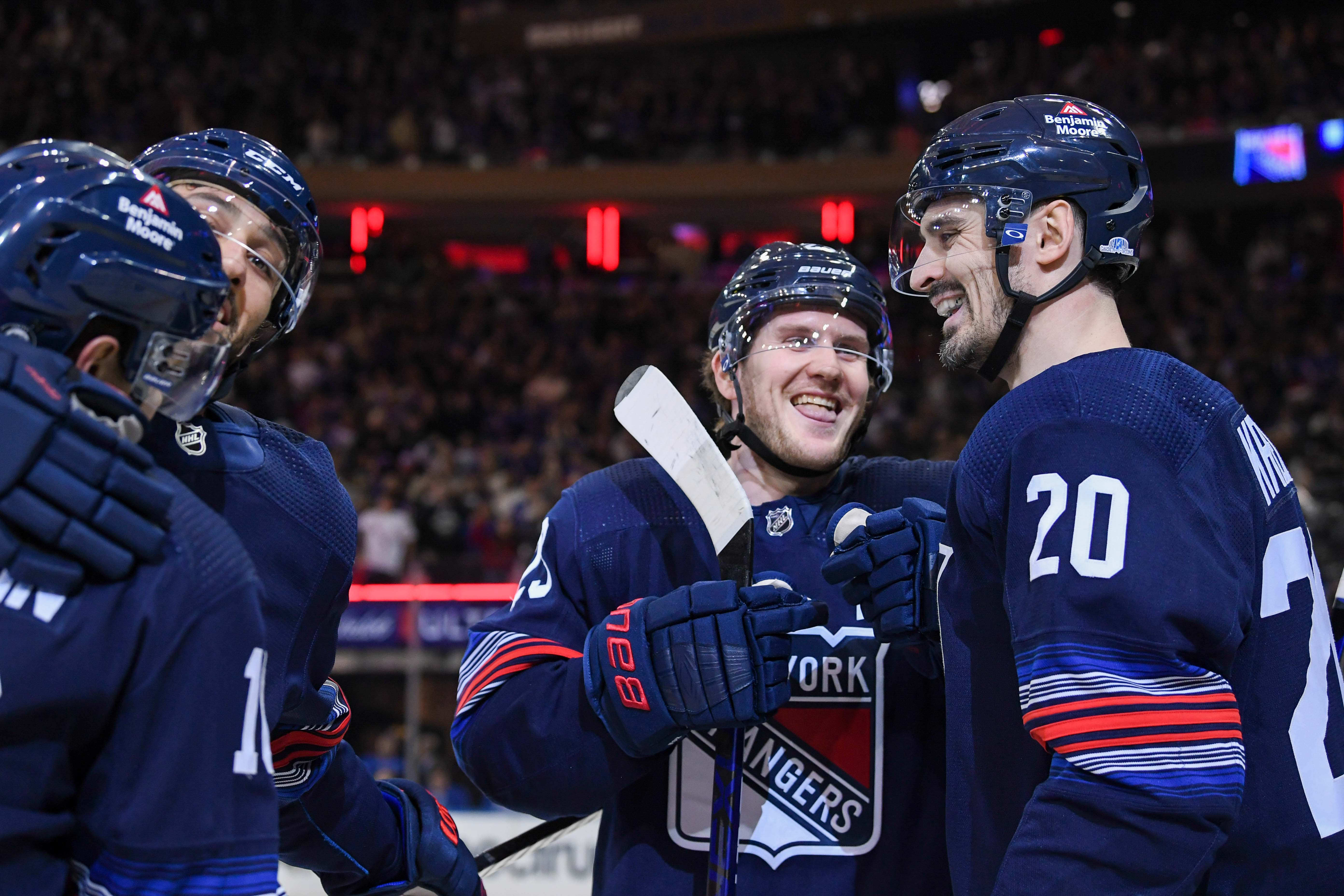 New York Rangers defenseman Adam Fox (23) and New York Rangers left wing Chris Kreider (20) celebrate the goal by New York Rangers left wing Artemi Panarin (10) against the Buffalo Sabres during the first period at Madison Square Garden