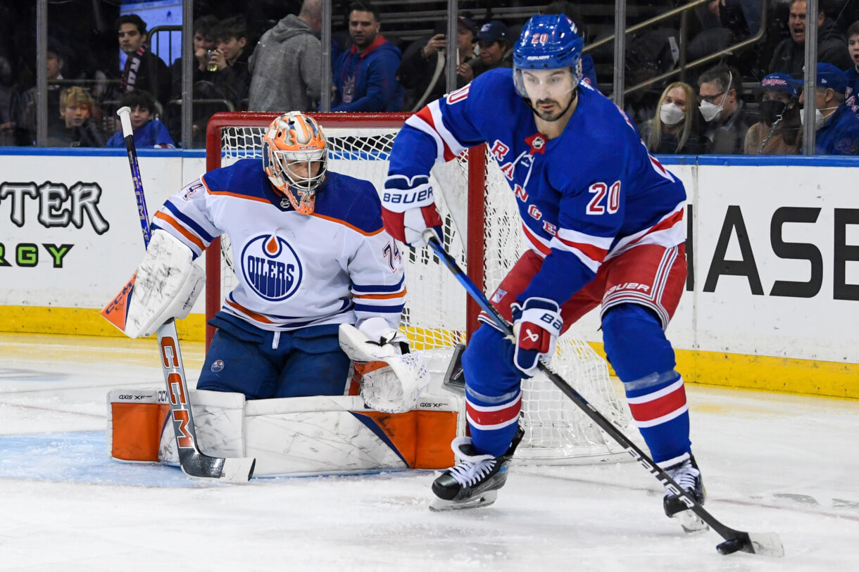 New York Rangers left wing Chris Kreider (20) plays the puck in front of Edmonton Oilers goaltender Stuart Skinner (74) during the second period at Madison Square Garden