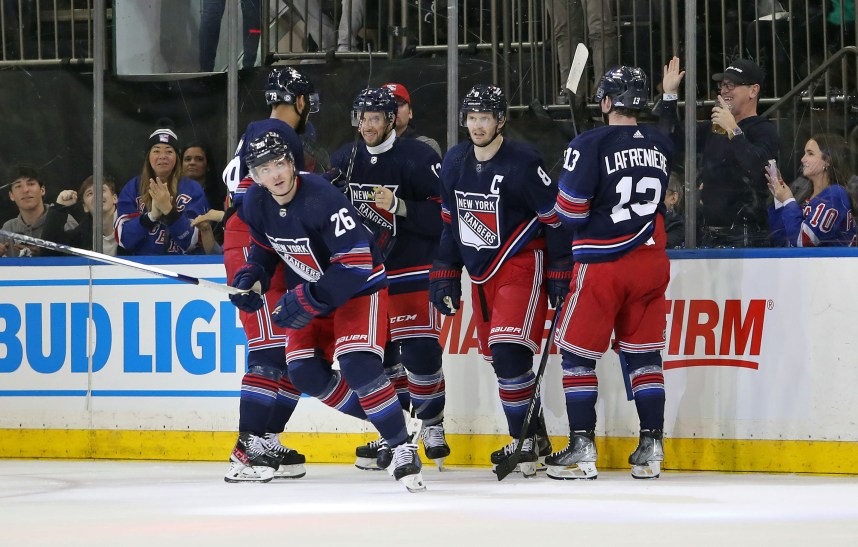 New York Rangers left wing Jimmy Vesey (26) celebrates his goal with center Nick Bonino (12), forward Alexis Lafreniere (13), defenseman K'Andre Miller (79) and defenseman Jacob Trouba (8) during the second period against the Los Angeles Kings at Madison Square Garden