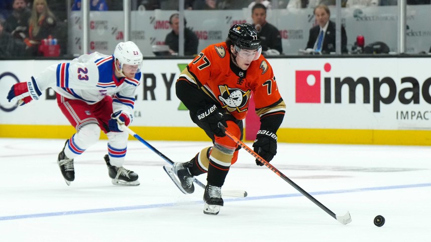 Anaheim Ducks right wing Frank Vatrano (77) skates with the puck against New York Rangers defenseman Adam Fox (23) in the second period at Honda Center