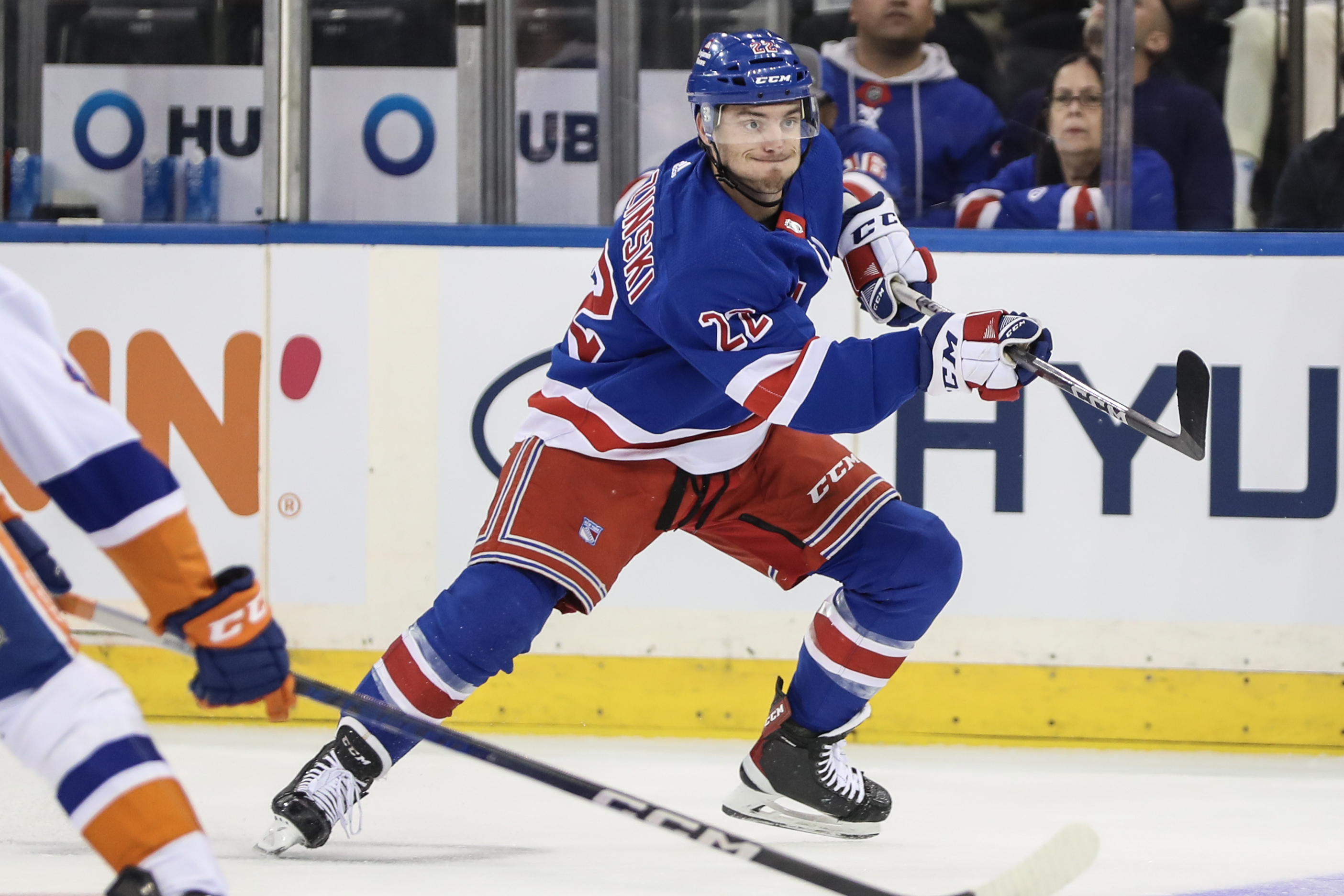 New York Rangers center Jonny Brodzinski (22) passes the puck in the first period against the New York Islanders at Madison Square Garden