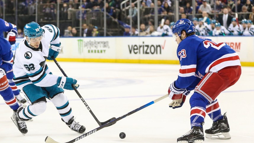 San Jose Sharks right wing Kevin Labanc (62) attempts to shoot the puck past New York Rangers defenseman Adam Fox (23) in the first period at Madison Square Garden