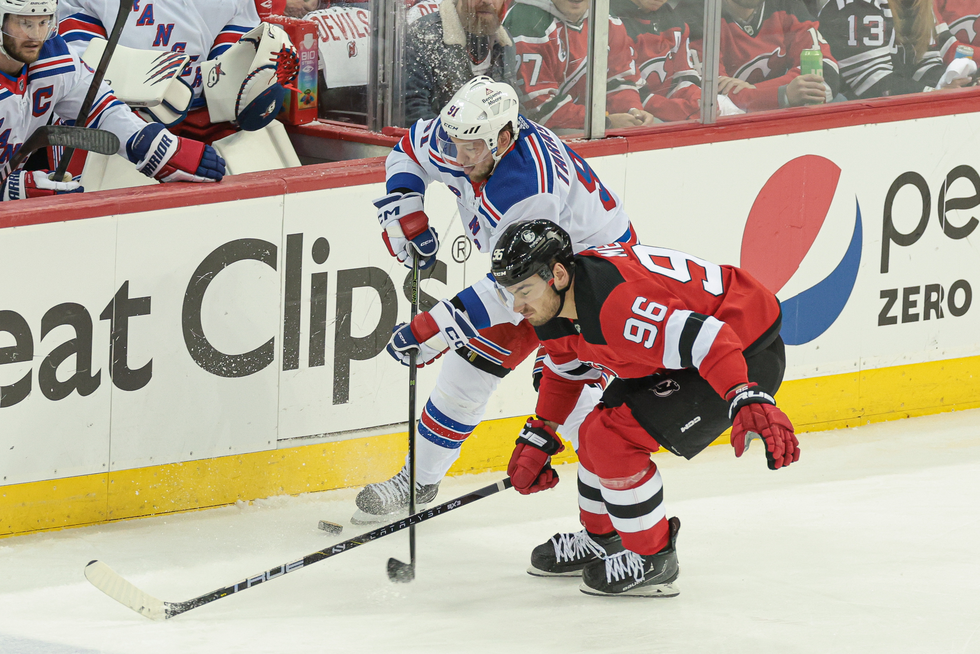 New York Rangers right wing Vladimir Tarasenko (91) battles New Jersey Devils right wing Timo Meier (96) for the puck during the first period in game seven of the first round of the 2023 Stanley Cup Playoffs at Prudential Center