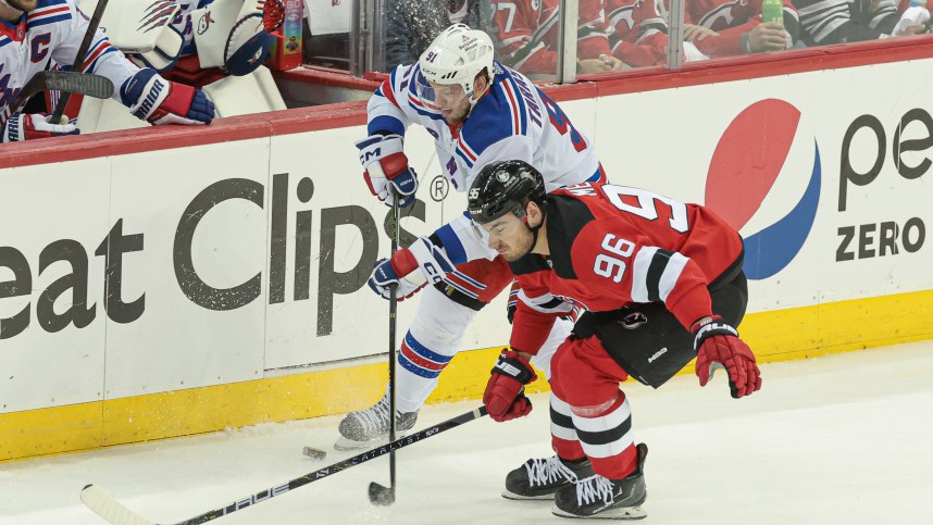 New York Rangers right wing Vladimir Tarasenko (91) battles New Jersey Devils right wing Timo Meier (96) for the puck during the first period in game seven of the first round of the 2023 Stanley Cup Playoffs at Prudential Center