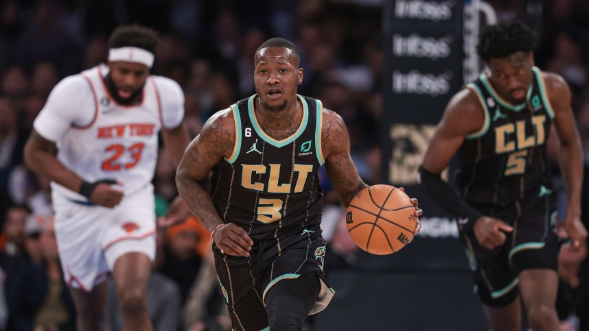 Charlotte Hornets guard Terry Rozier (3) dribbles up court  in front of New York Knicks center Mitchell Robinson (23) and center Mark Williams (5) during the first quarter at Madison Square Garden
