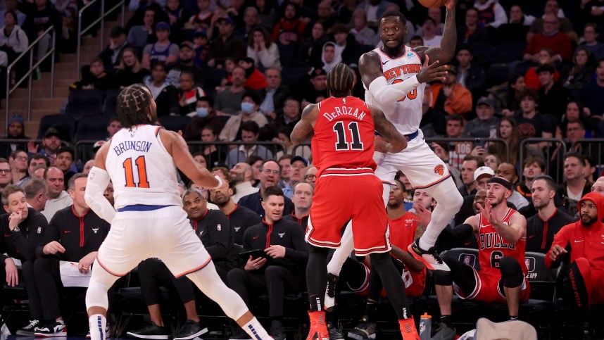 New York Knicks forward Julius Randle (30) looks to pass the ball to guard Jalen Brunson (11) after stealing a pass intended for Chicago Bulls forward DeMar DeRozan (11) during the third quarter at Madison Square Garden