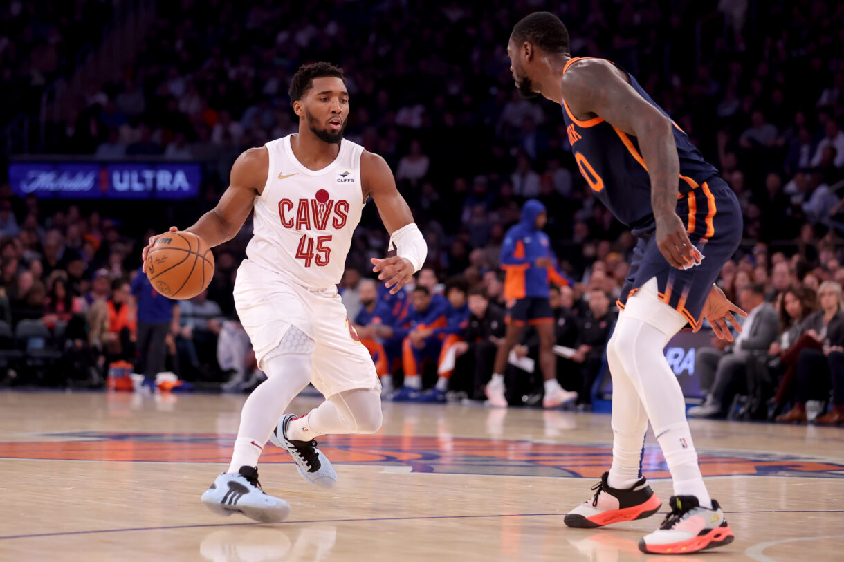 Cleveland Cavaliers guard Donovan Mitchell (45) controls the ball against New York Knicks forward Julius Randle (30) during the first quarter at Madison Square Garden