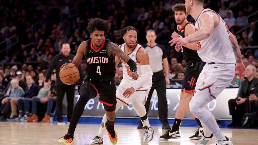 Houston Rockets guard Jalen Green (4) controls the ball against New York Knicks guard Jalen Brunson (11) and center Isaiah Hartenstein (55) during the fourth quarter at Madison Square Garden