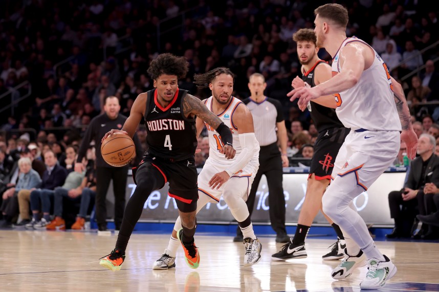Houston Rockets guard Jalen Green (4) controls the ball against New York Knicks guard Jalen Brunson (11) and center Isaiah Hartenstein (55) during the fourth quarter at Madison Square Garden