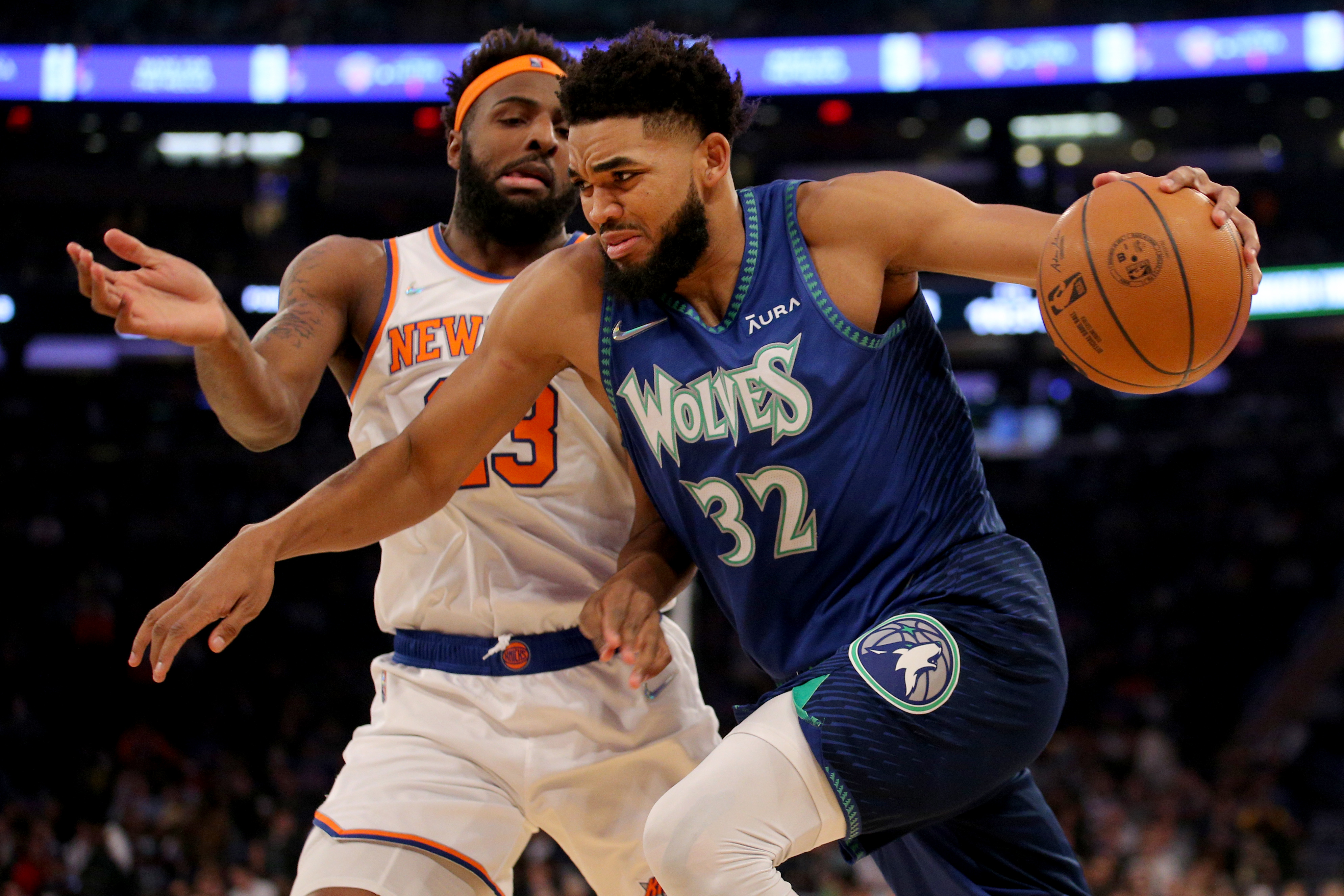 Minnesota Timberwolves center Karl-Anthony Towns (32) drives to the basket against New York Knicks center Mitchell Robinson (23) during the first quarter at Madison Square Garden