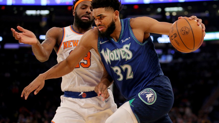 Minnesota Timberwolves center Karl-Anthony Towns (32) drives to the basket against New York Knicks center Mitchell Robinson (23) during the first quarter at Madison Square Garden