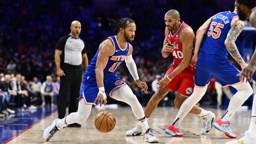 New York Knicks guard Jalen Brunson (11) controls the ball against the Philadelphia 76ers in the first quarter at Wells Fargo Center