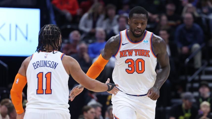 New York Knicks forward Julius Randle (30) and guard Jalen Brunson (11) react to a play against the Utah Jazz during the third quarter at Delta Center