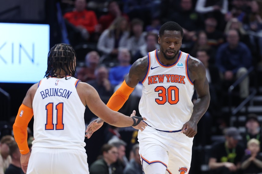 New York Knicks forward Julius Randle (30) and guard Jalen Brunson (11) react to a play against the Utah Jazz during the third quarter at Delta Center