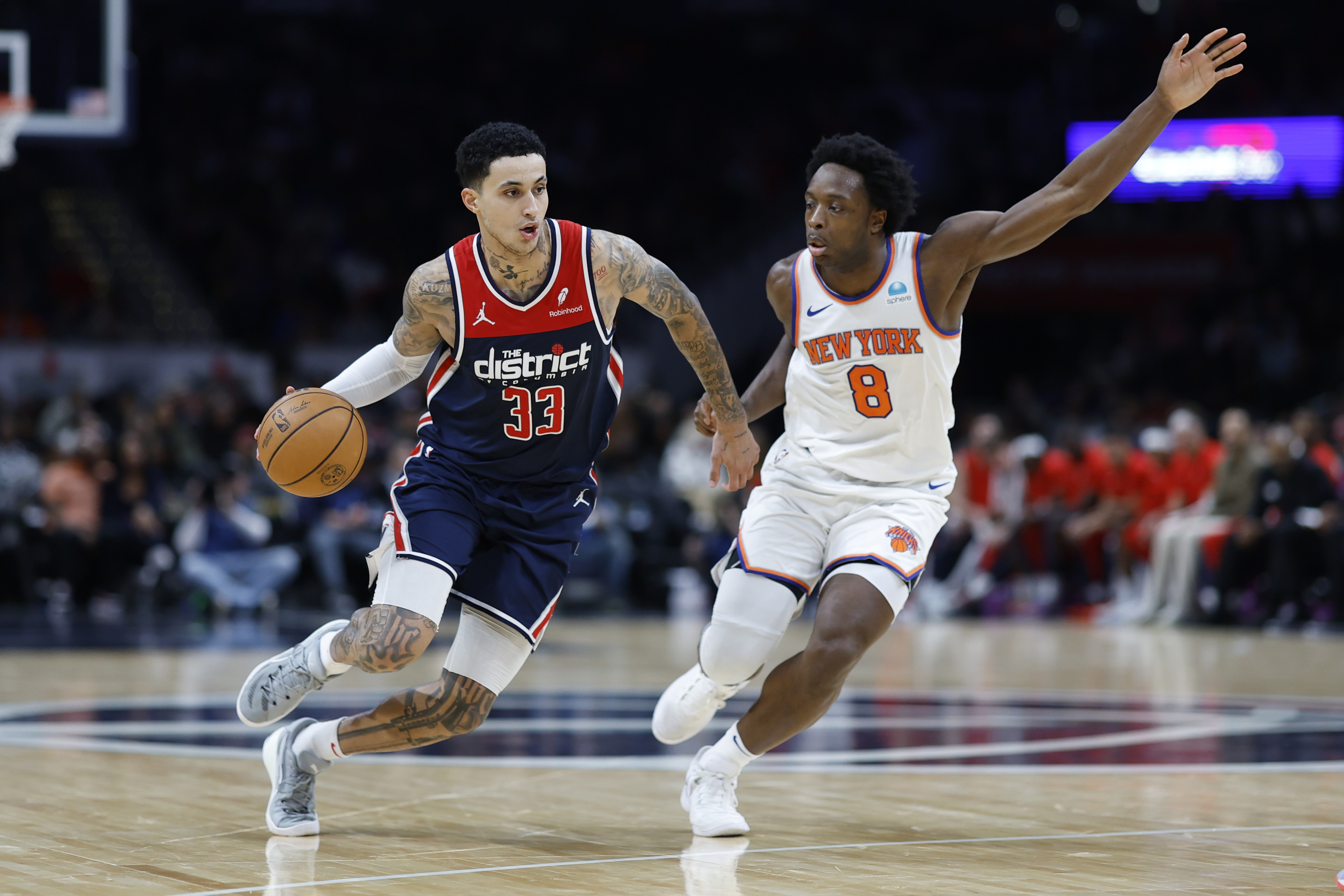 Washington Wizards forward Kyle Kuzma (33) drives to the basket as New York Knicks forward OG Anunoby (8) defends in the third quarter at Capital One Arena