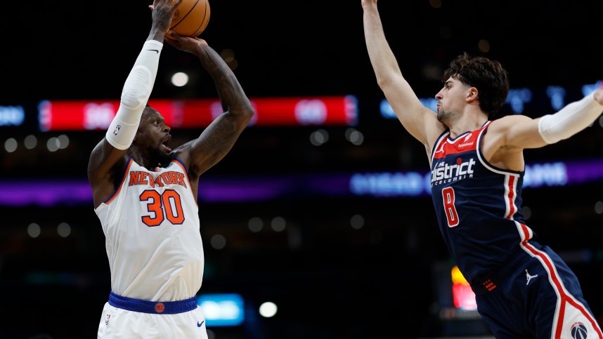New York Knicks forward Julius Randle (30) shoots the ball over Washington Wizards forward Deni Avdija (8) in the second quarter at Capital One Arena