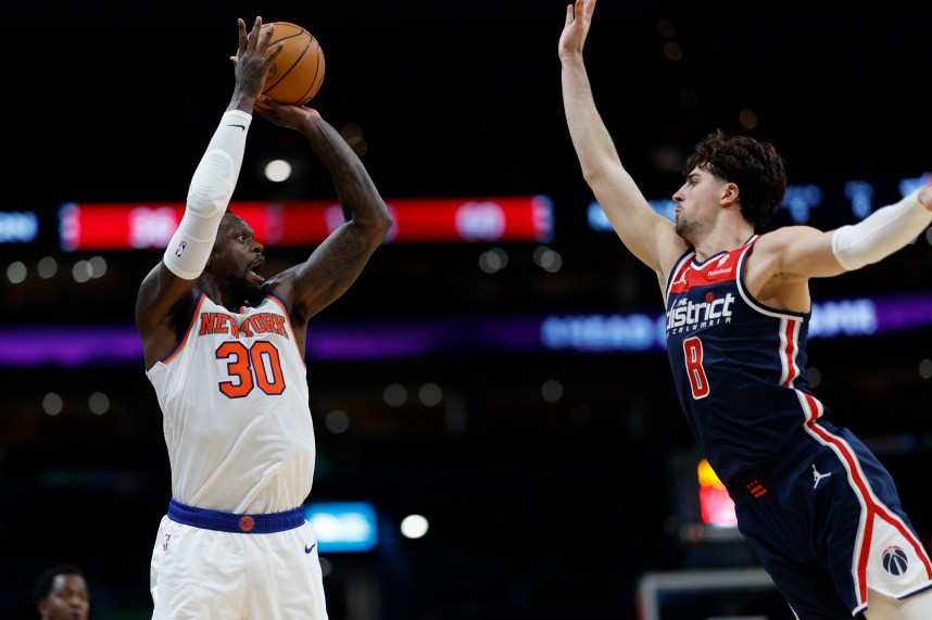 New York Knicks forward Julius Randle (30) shoots the ball over Washington Wizards forward Deni Avdija (8) in the second quarter at Capital One Arena