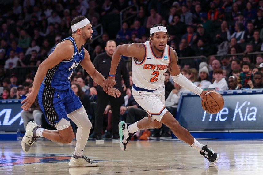 New York Knicks guard Miles McBride (2) dribbles against Orlando Magic guard Jalen Suggs (4) during the second half at Madison Square Garden