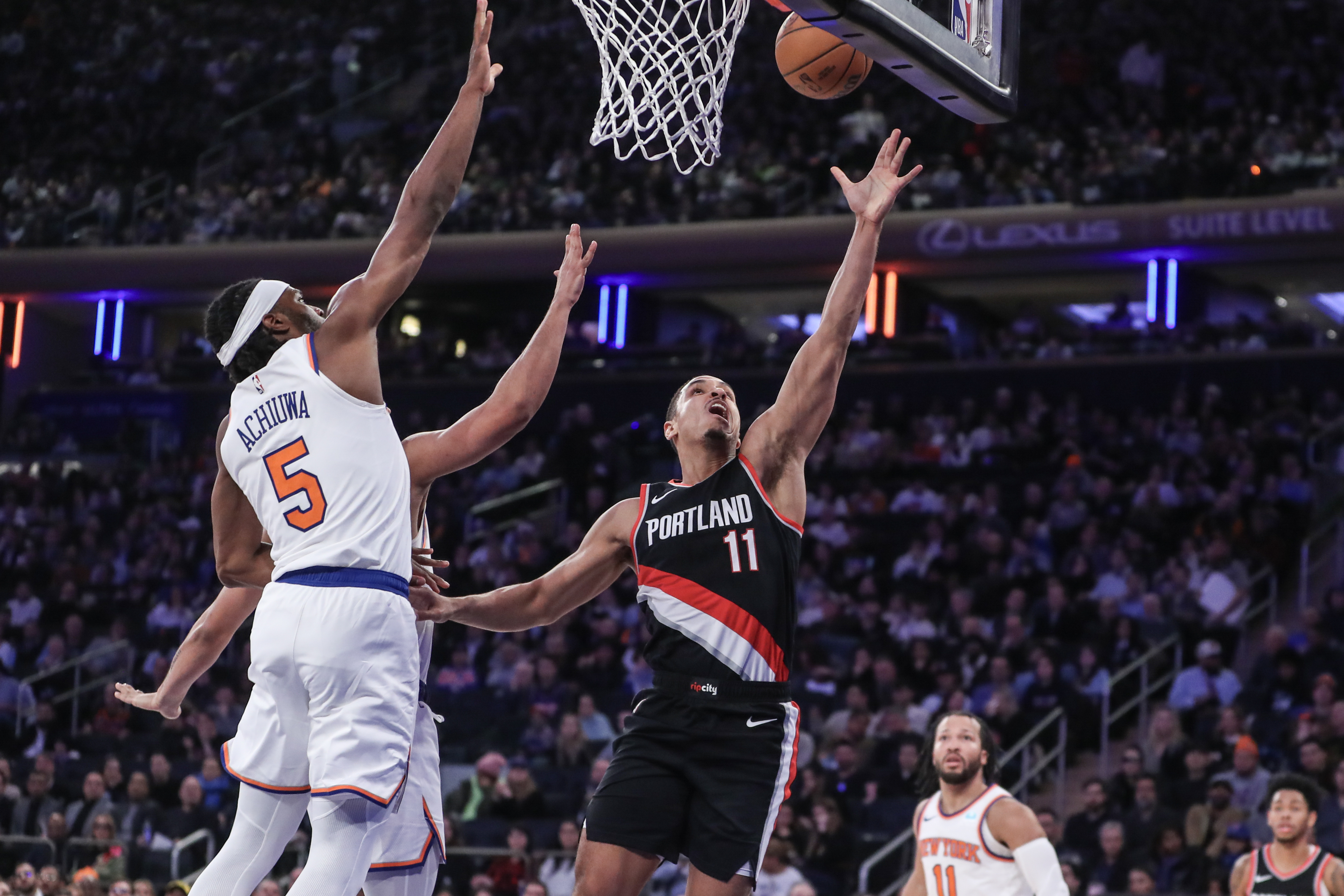 Portland Trail Blazers guard Malcolm Brogdon (11) drives past New York Knicks forward Precious Achiuwa (5) for layup in the second quarter at Madison Square Garden