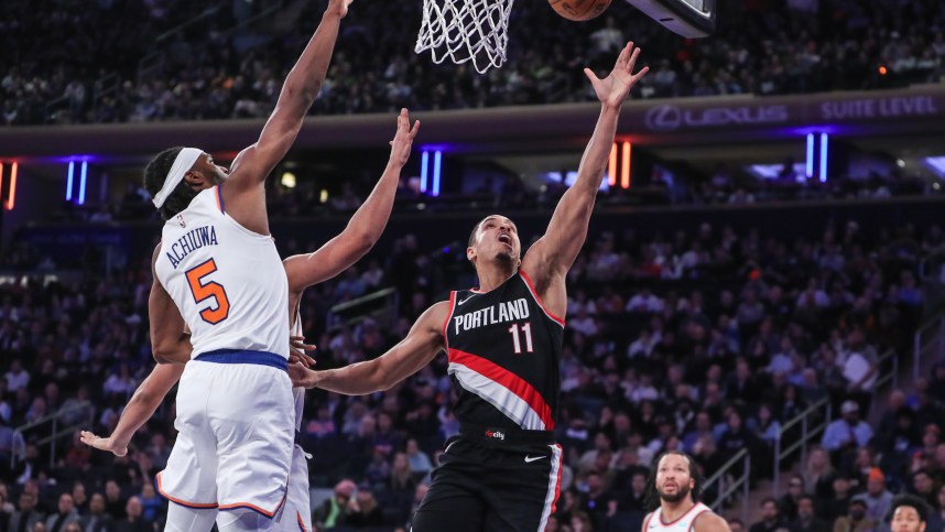 Portland Trail Blazers guard Malcolm Brogdon (11) drives past New York Knicks forward Precious Achiuwa (5) for layup in the second quarter at Madison Square Garden