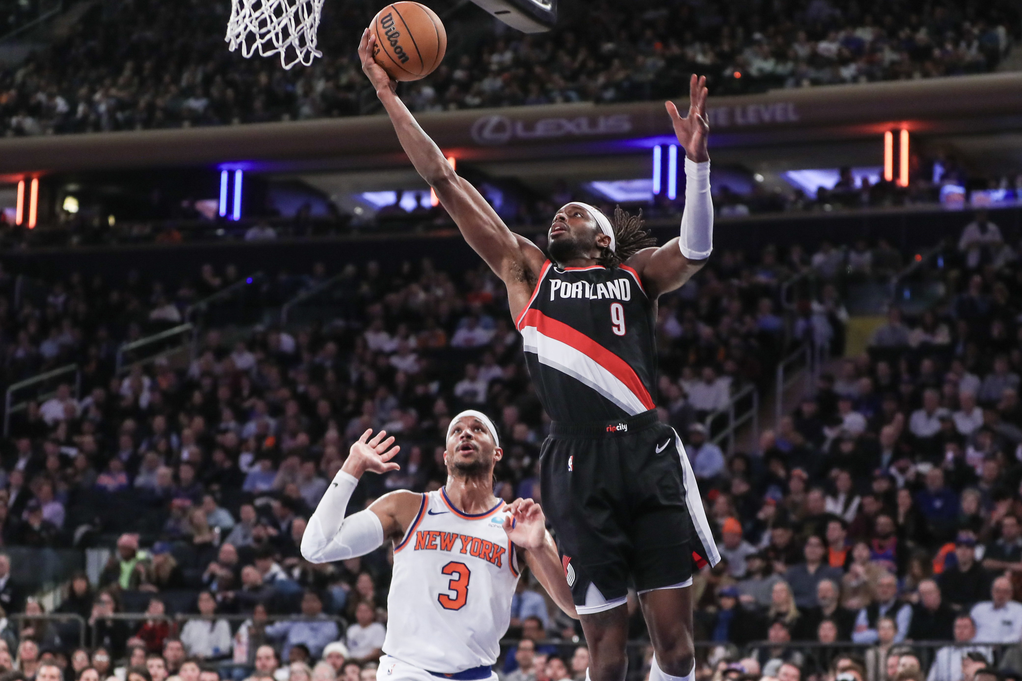 Portland Trail Blazers forward Jerami Grant (9) drives past New York Knicks guard Josh Hart (3) for a layup in the second quarter at Madison Square Garden