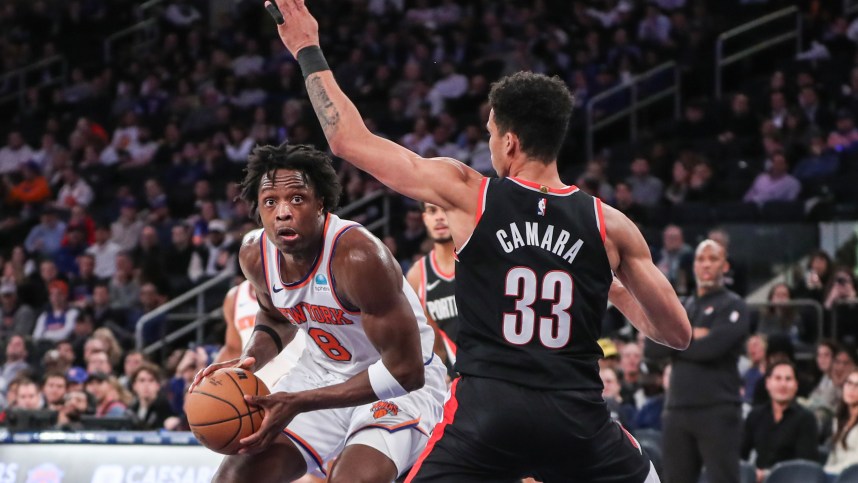 New York Knicks forward OG Anunoby (8) looks to drive past Portland Trail Blazers forward Toumani Camara (33) in the fourth quarter at Madison Square Garden