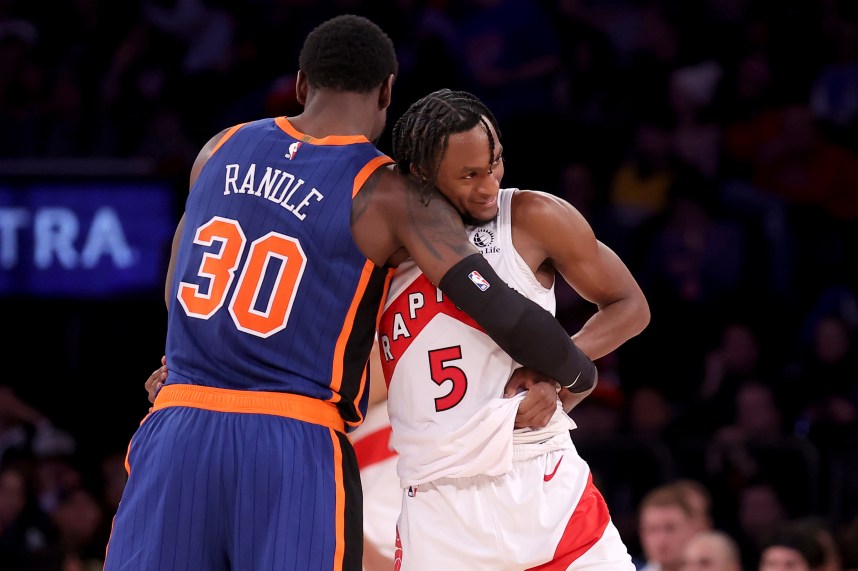Toronto Raptors guard Immanuel Quickley (5) hugs New York Knicks forward Julius Randle (30) after being substituted out of the game during the fourth quarter at Madison Square Garden
