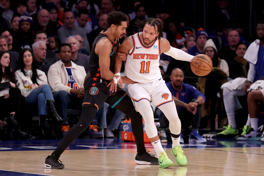New York Knicks guard Jalen Brunson (11) controls the ball against Washington Wizards guard Jordan Poole (13) during the fourth quarter at Madison Square Garden