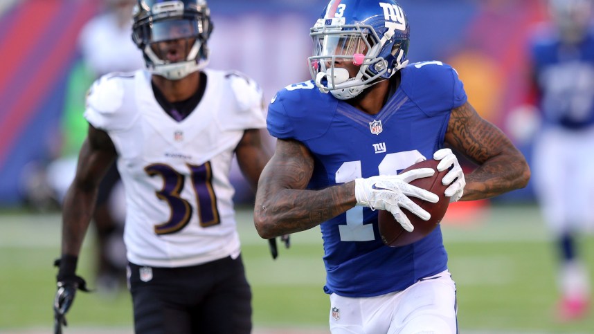 New York Giants wide receiver Odell Beckham Jr. (13) runs for a touchdown against Baltimore Ravens corner back Will Davis (31) during the fourth quarter at MetLife Stadium