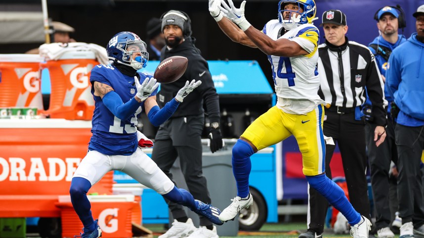 New York Giants wide receiver Jalin Hyatt (13) attempts to catch a pass as Los Angeles Rams cornerback Ahkello Witherspoon (44) defends during the first half at MetLife Stadium