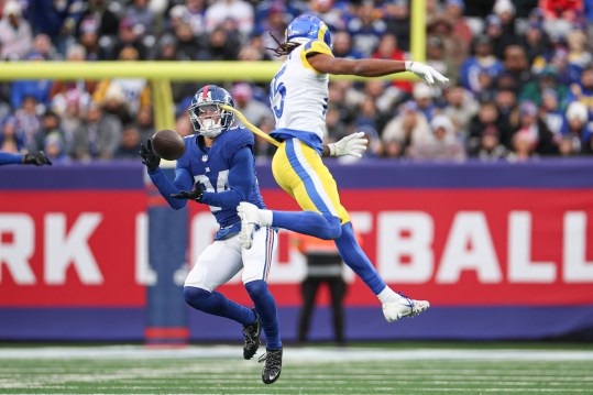 New York Giants safety Dane Belton (24) intercepts a pass intended for Los Angeles Rams wide receiver Demarcus Robinson (15) during the second half at MetLife Stadium