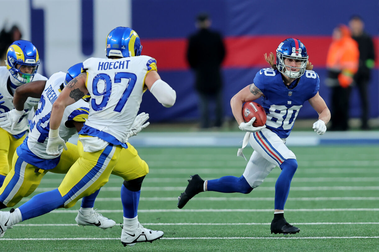 New York Giants wide receiver Gunner Olszewski (80) returns a punt against Los Angeles Rams linebacker Michael Hoecht (97) and running back Royce Freeman (24) during the fourth quarter at MetLife Stadium