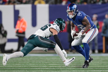 New York Giants tight end Darren Waller (12) makes a catch in front of Philadelphia Eagles safety Tristin McCollum (36) during the second half at MetLife Stadium